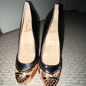 Christian Louboutin heels. These are high and there is a platform.